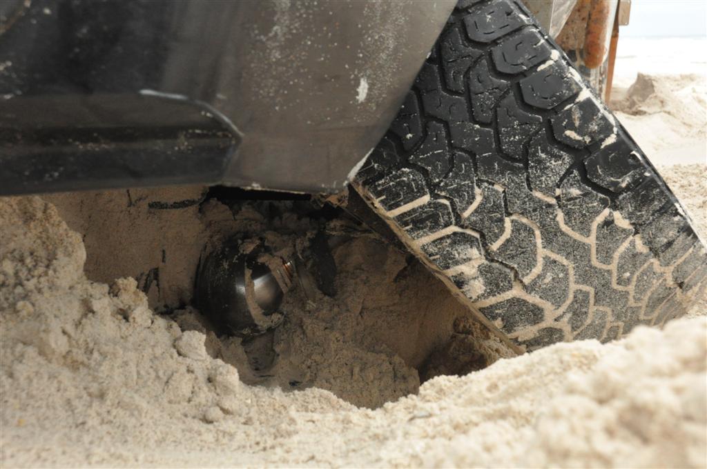 Landcruiser busted on the beach