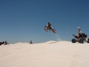 Bike Jump in the Lancelin Dunes A motorbike jumping a dune