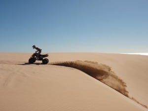 Lucky Bay Dunes Riding a quad in the dunes