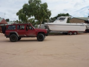 Coral Bay Accommodation - Bayview Caravan Park Bayview Caravan Park chalets and a big boat
