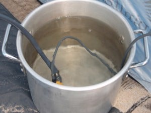 Portable Shower Pump A pot of warm water and the shower pump