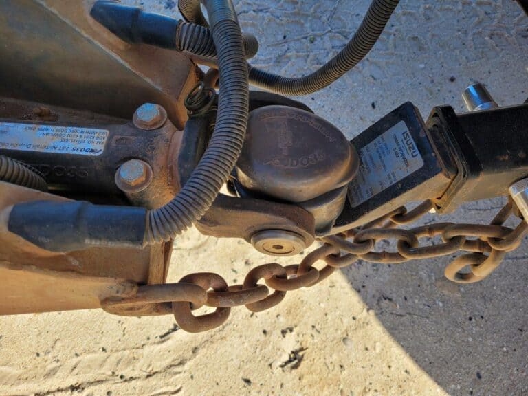 Should you cross your trailer chains, and why?