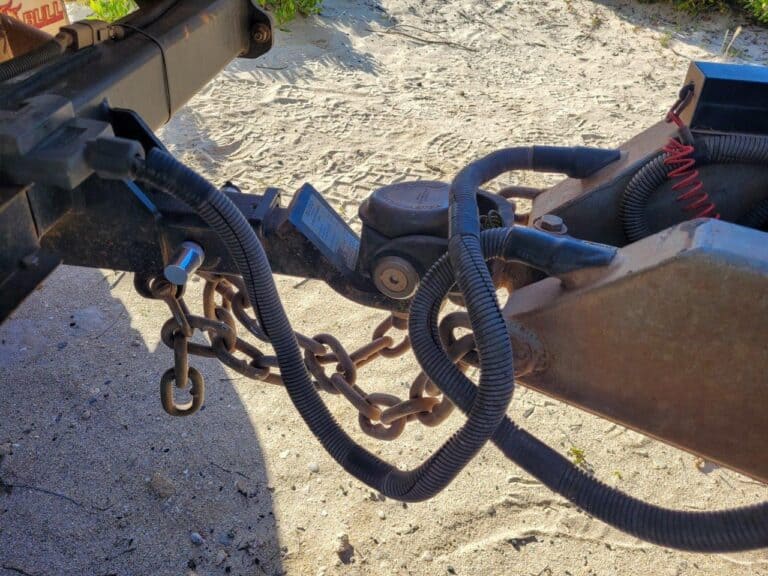 Should you cross your trailer chains, and why?
